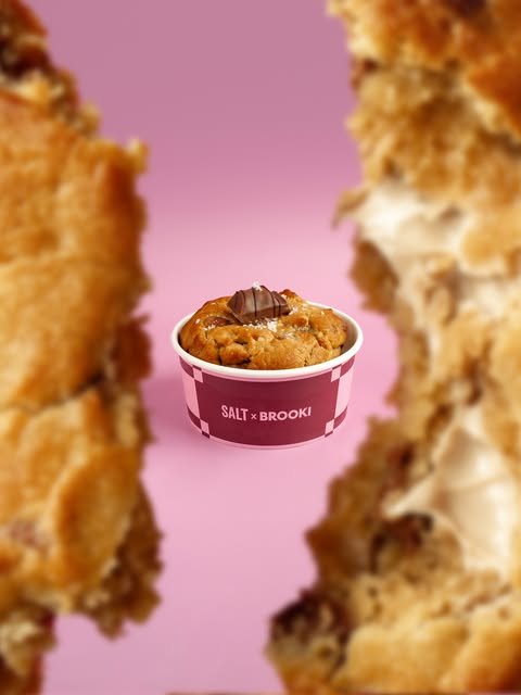SALT × Brooki cookie softie cup on pink background