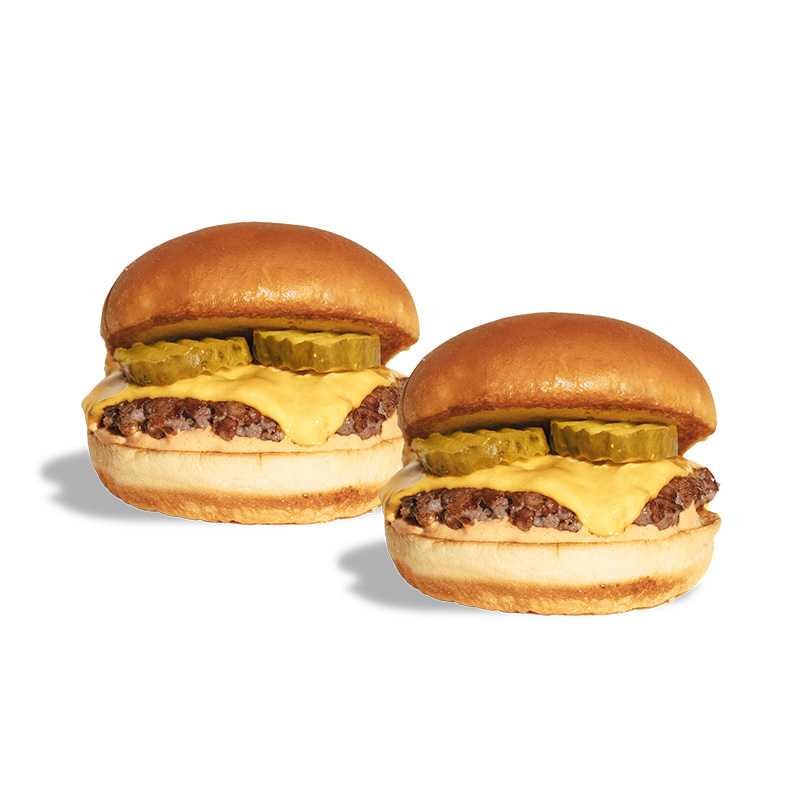 Two SALT Original Beef Sliders with cheese and pickles